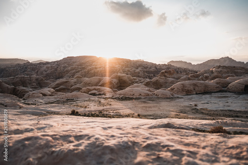 Rocks of arid landscape on sunrise in desert of Jordan, Asia photo