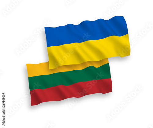 National vector fabric wave flags of Lithuania and Ukraine isolated on white background. 1 to 2 proportion.