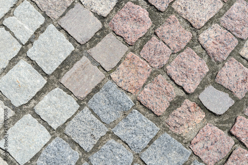 old road sidewalk paved with granite of different colors
