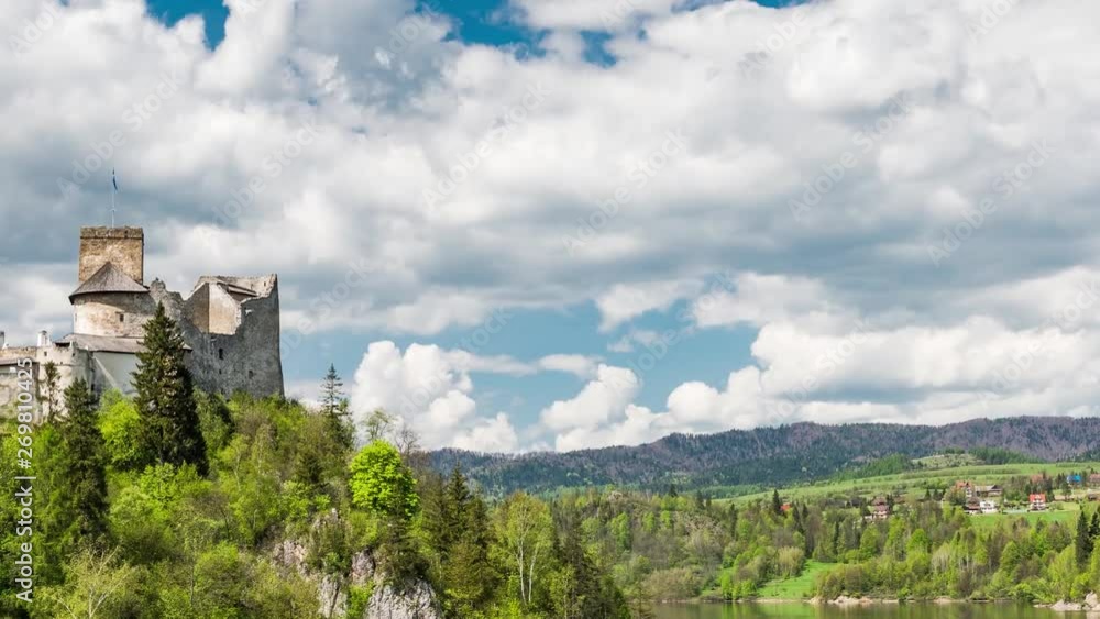 Niedzica Castle at Czorsztyn Lake in Poland at Summer Day. Architecture Famous Landmark and Travel Destination. Zoom out Time Lapse. Niedzica Castle at Czorsztyn Lake in Poland at Summer Day. Architecture Famous Landmark and Travel Destination. Zoom out Time Lapse.