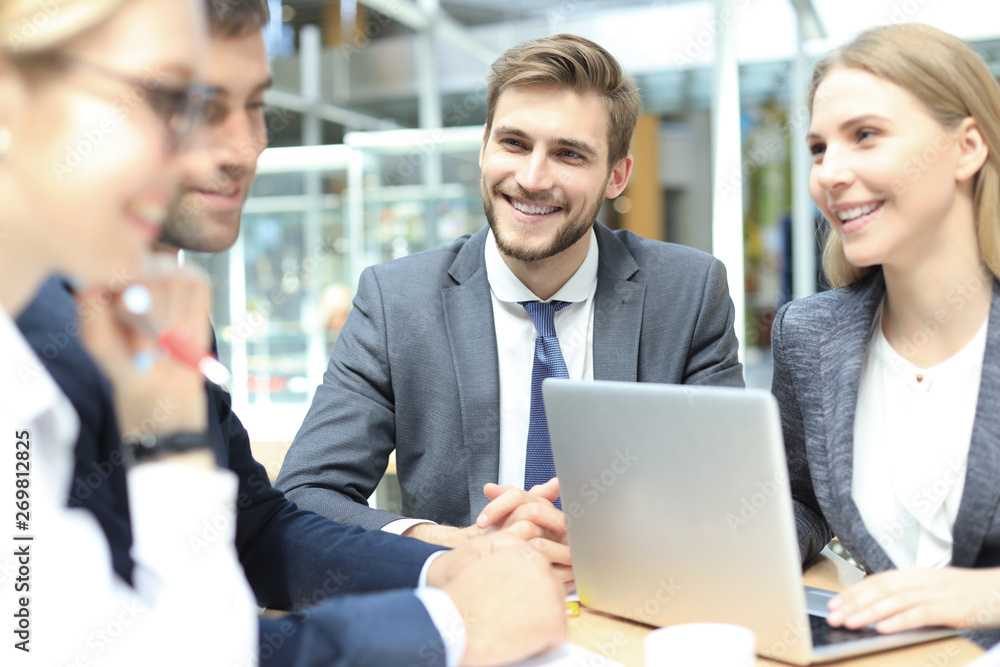 Group of business partners discussing ideas and planning work in office. Group of business partners discussing ideas and planning work in office.