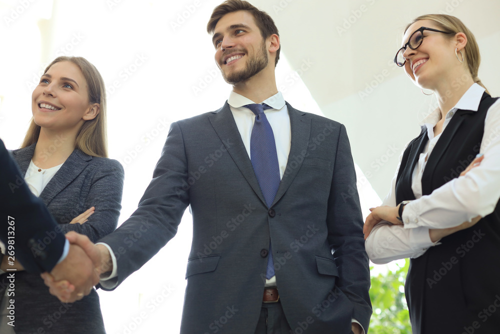 Business people shaking hands, finishing up a meeting. Business people shaking hands, finishing up a meeting.