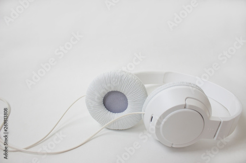 White headphones on a light background.