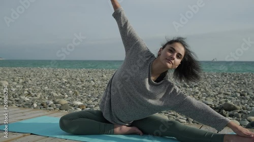 Happy girl exrcising outside on fresh air. photo