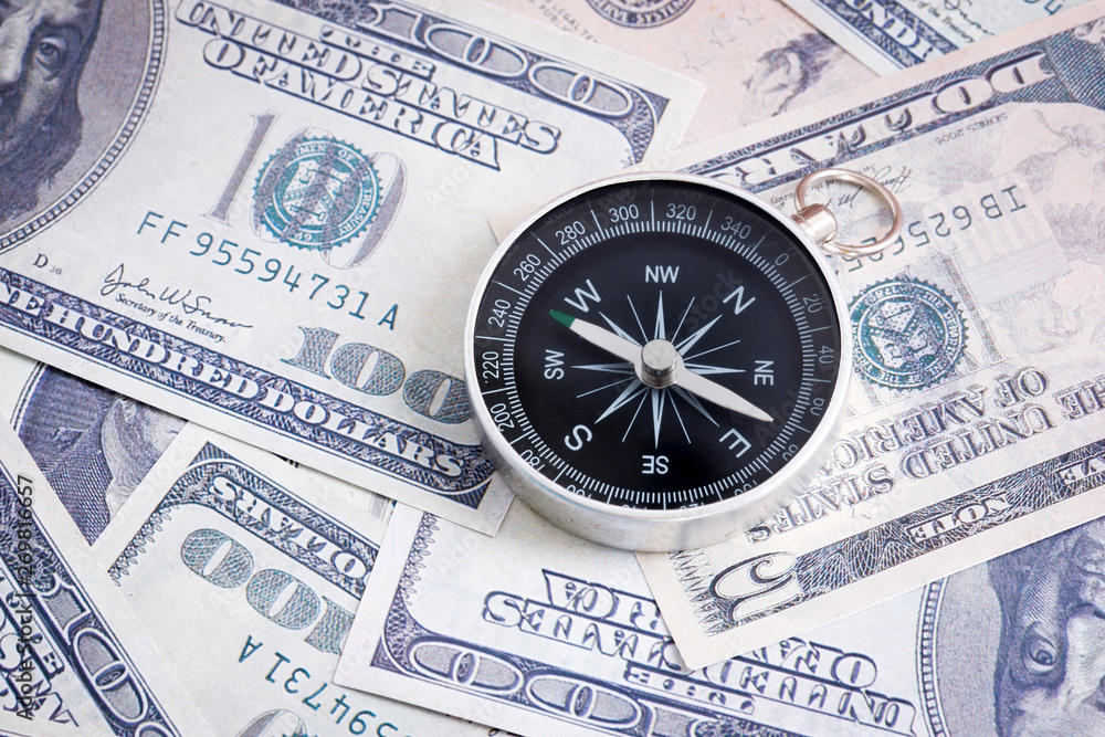 Financial Concept : US Dollar and Compass. Financial Concept : US Dollar and Compass.