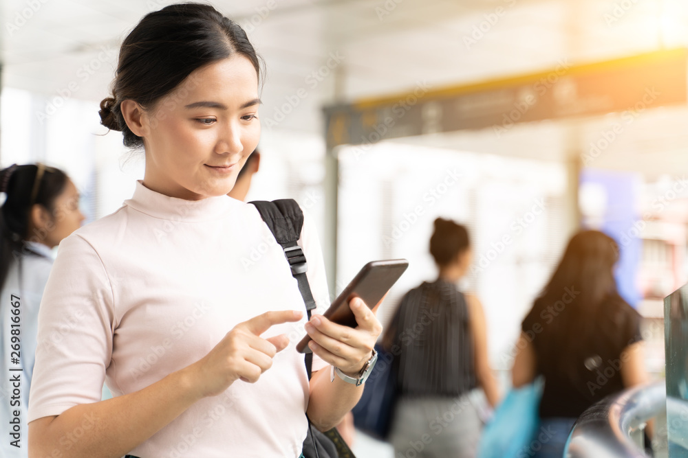 Happy woman using smart phone in the city Happy woman using smart phone in the city