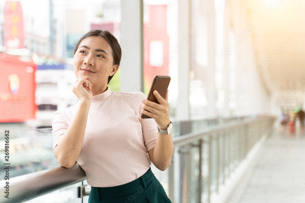 Happy woman using smart phone in the city Happy woman using smart phone in the city