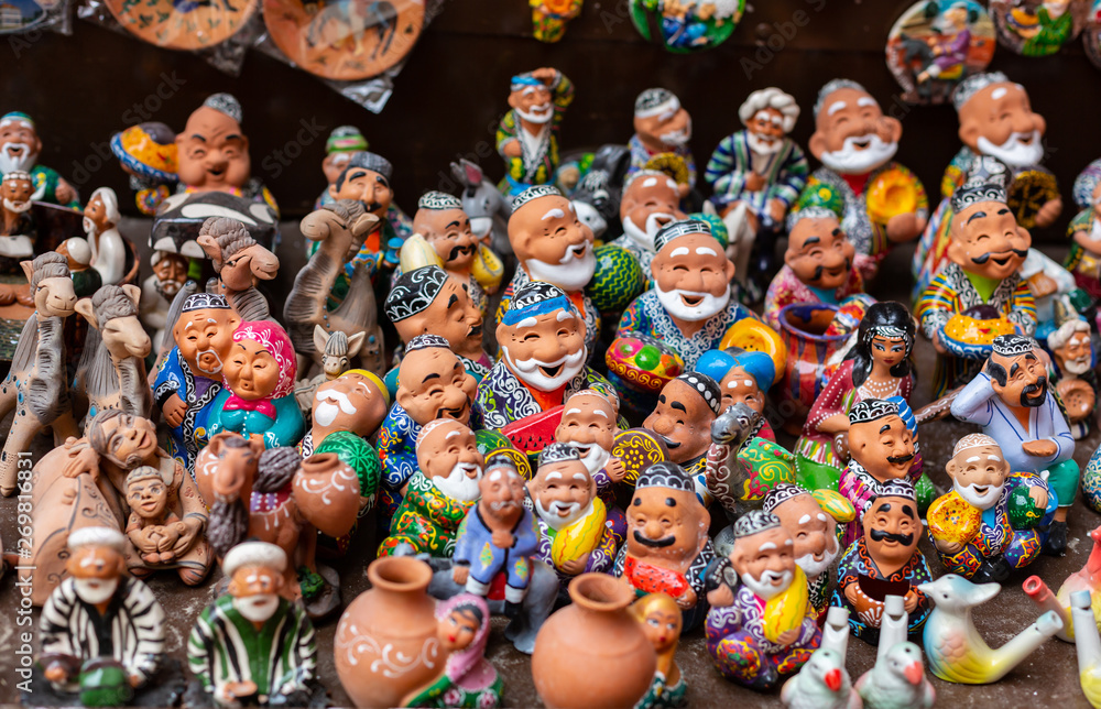 the showcase with Uzbek Souvenirs, ceramic figurines of people