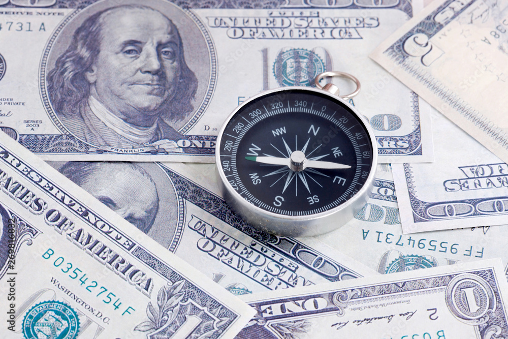 Financial Concept : US Dollar and Compass. Financial Concept : US Dollar and Compass.