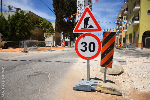 Roadwork and speed limit traffic signs in Yehud - small city in central Israel.  photo