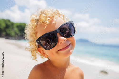  boy are playing on the beach