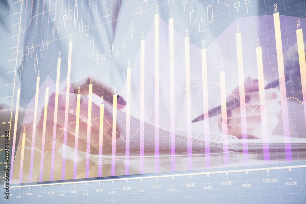 Financial chart drawn over hands taking notes background. Concept of research. Multi exposure Financial chart drawn over hands taking notes background. Concept of research. Multi exposure