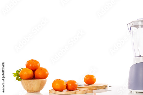 Fototapeta Naklejka Na Ścianę i Meble -  orange goldern and fruit shaker on the table