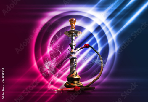 Hookah, smoke on a dark abstract background. Background of empty scenes with multicolored neon lights, reflection of night lights on wet pavement