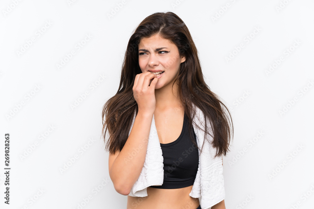 Teenager sport girl over isolated white background nervous and scared Teenager sport girl over isolated white background nervous and scared