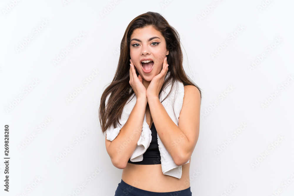 Teenager sport girl over isolated white background with surprise facial expression Teenager sport girl over isolated white background with surprise facial expression