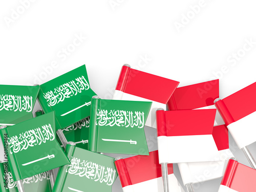 Pins with flags of Saudi Arabia and indonesia isolated on white.