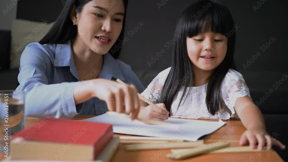education concept. The teacher is teaching the girl to draw. education concept. The teacher is teaching the girl to draw.