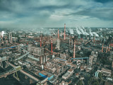 Industrial zone landscape aerial view with smoke from metallurgical factory or plant chimneys. Air and environment pollution, global warming