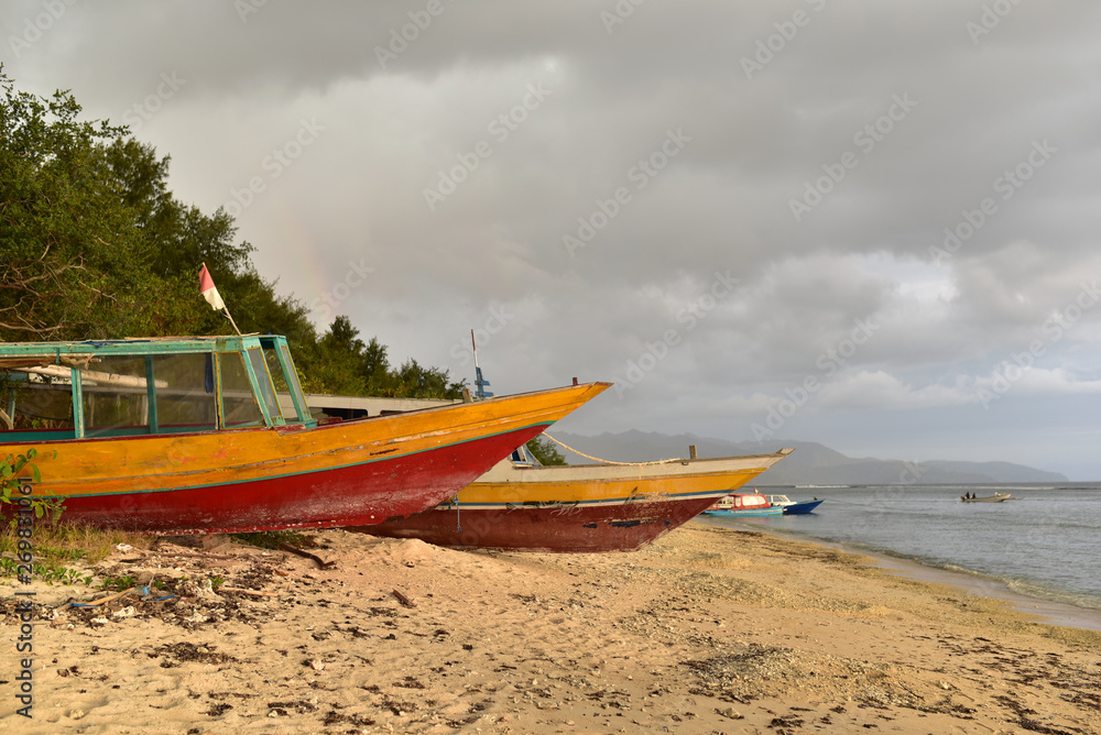 Boats docked on the sandy beach in Gili Meno Island, Lombok, Indonesia
