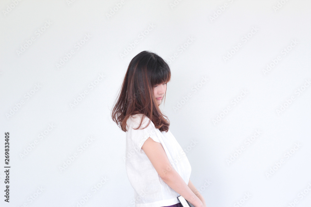 Fashion Portrait of Young asian woman smilling wearing natural fabric linen minimal clothing - copy space white background Fashion Portrait of Young asian woman smilling wearing natural fabric linen minimal clothing - copy space white background