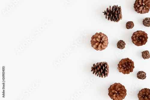 Pine cones on a white table. Flat lay with blank copy space.