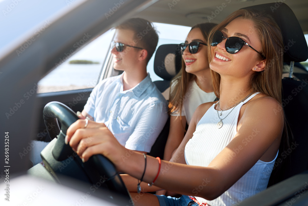 Group of friends rented a car on summer road trip and arrived to the ...