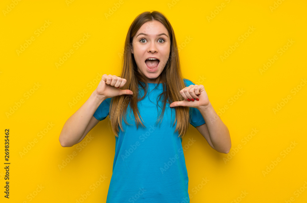 Young woman with blue shirt proud and self-satisfied Young woman with blue shirt proud and self-satisfied