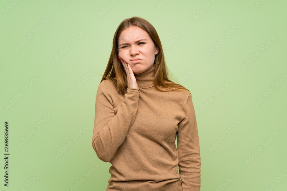 Young woman with turtleneck sweater with toothache Young woman with turtleneck sweater with toothache