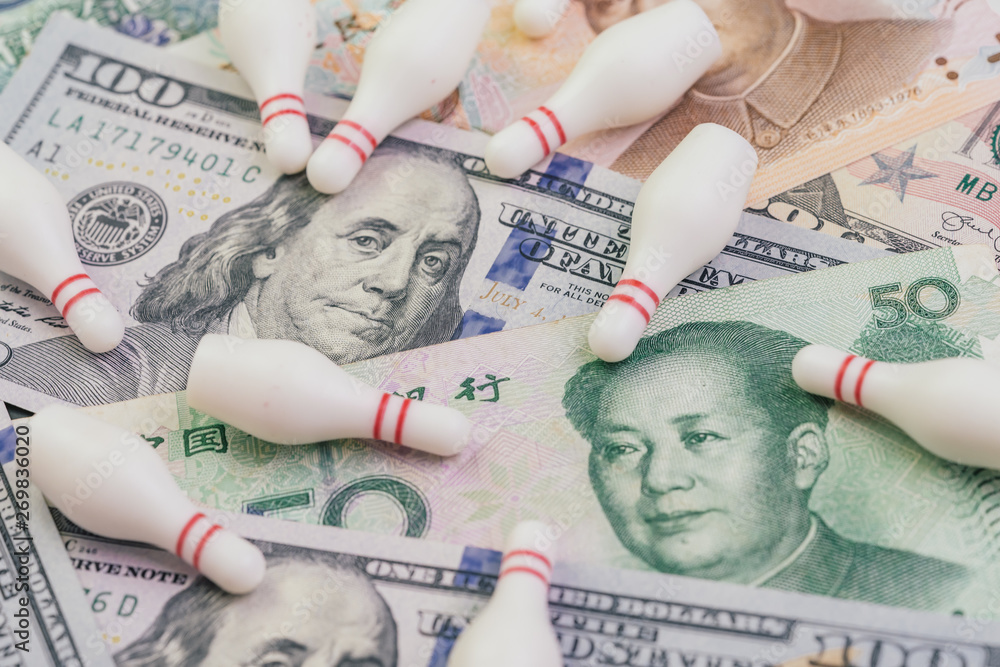 US and China Trade war and tariff negotiation fail concept, bowling pin  falling apart on United States America and Chinese banknotes, crisis  situation metaphor Stock Photo | Adobe Stock