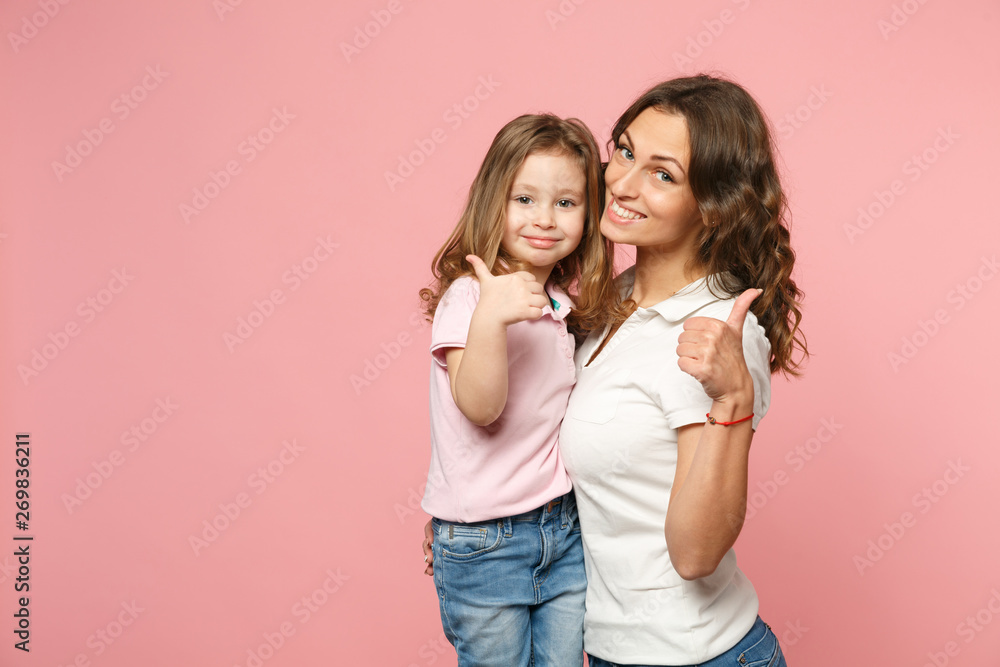 Woman in light clothes have fun with cute child baby girl. Mother, little kid daughter isolated on pastel pink wall background, studio portrait. Mother's Day, love family, parenthood childhood concept Woman in light clothes have fun with cute child baby girl. Mother, little kid daughter isolated on pastel pink wall background, studio portrait. Mother's Day, love family, parenthood childhood concept