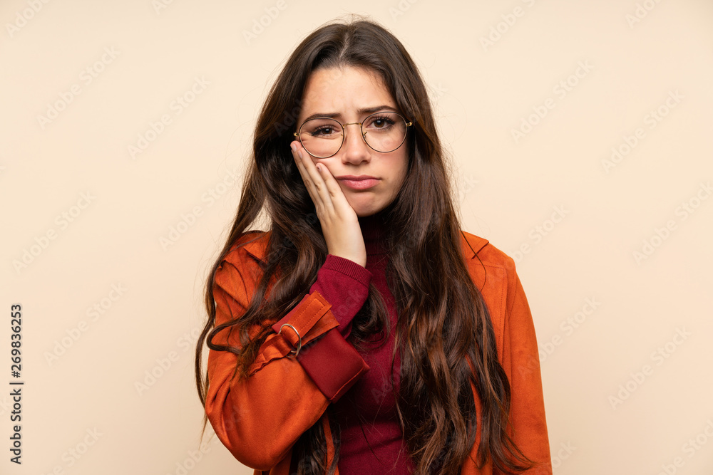 Teenager girl with coat unhappy and frustrated