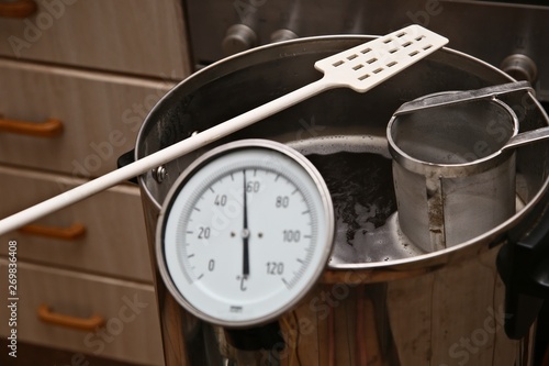 Brewing craft beer in a kitchen. Home brewing concept image. 