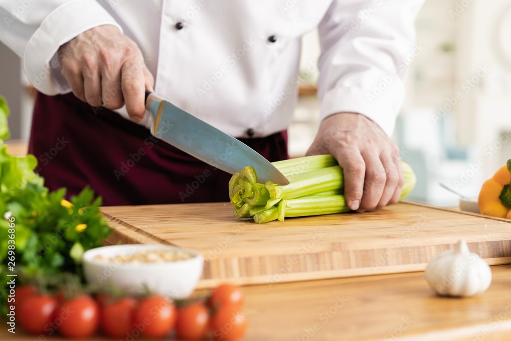 Chef cutting fresh and delicious vegetables for cooking. Chef cutting fresh and delicious vegetables for cooking.