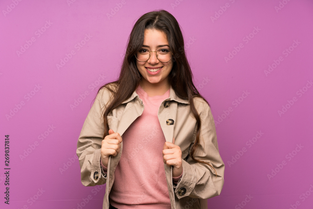 Teenager girl over purple wall proud and self-satisfied Teenager girl over purple wall proud and self-satisfied