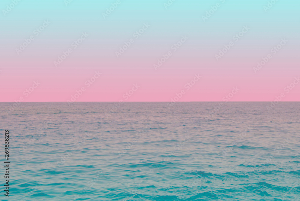 tender view of green water and blue pink gradient sky