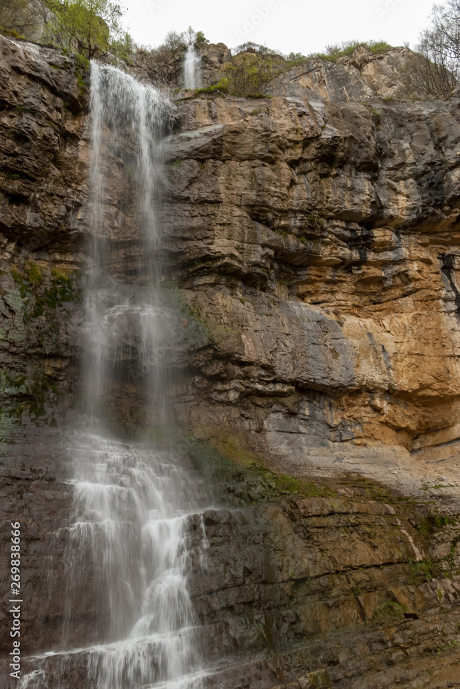 Landscape view of waterfall coming out of rock wall. Skaklya waterfall  is the highest waterfall on Balkan peninsula,  Balkan mountain range ( Stara Planina),  Bulgaria.