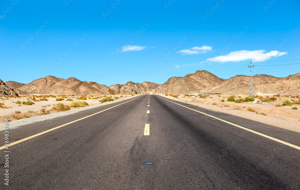 Road through mountains in desert