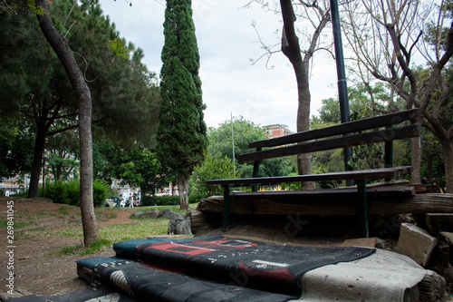 an open-air bench and a rug photo