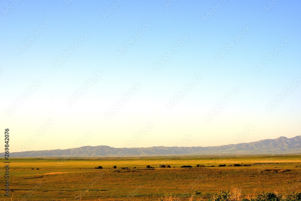 Rural area dawn landscape of fields and mountains near Saryozek, Almaty region Rural area dawn landscape of fields and mountains near Saryozek, Almaty region
