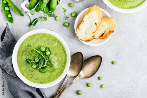 Summer cream soup with green fresh pea shoots