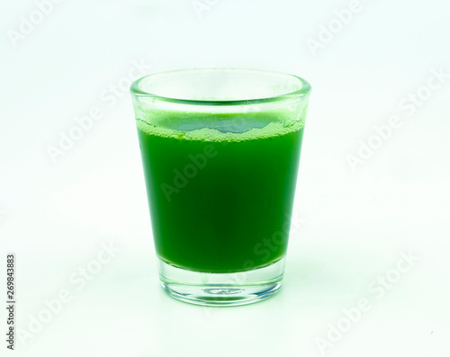 Wallpaper Mural shot of wheat grass juice on white background Torontodigital.ca