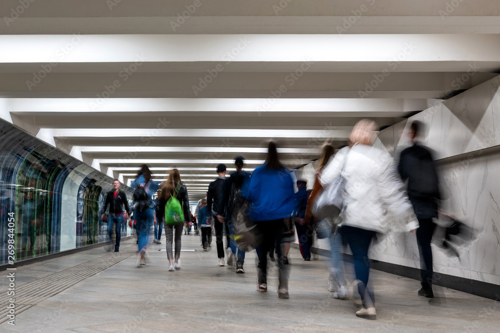Fototapeta premium people go through the underpass. back to us. in move