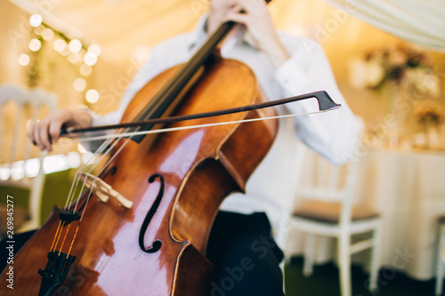 The music quartet plays at the wedding. String Quartet. The actor performs at a party. musical instrument. photo