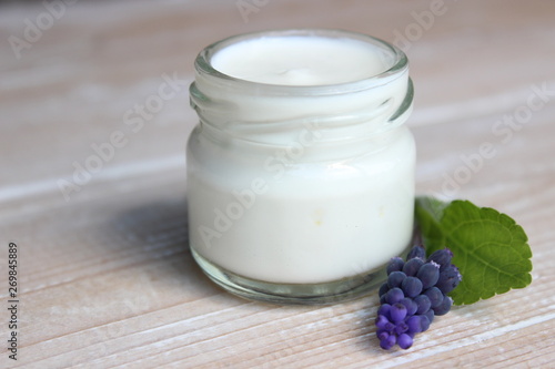 Organic face cream with purple flowers