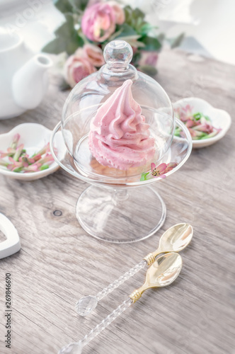 Delicate pink apple marshmallow hand-made in a glass transparent vase. Congratulate. Sign of attention. Marshmallow, dessert. Background.