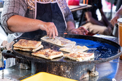 Photography Seller preparing murtabak at street stall for iftar during Ramadan