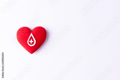Woman hand holding red heart for blood donation,world blood donor day. Copy space for advertisers.