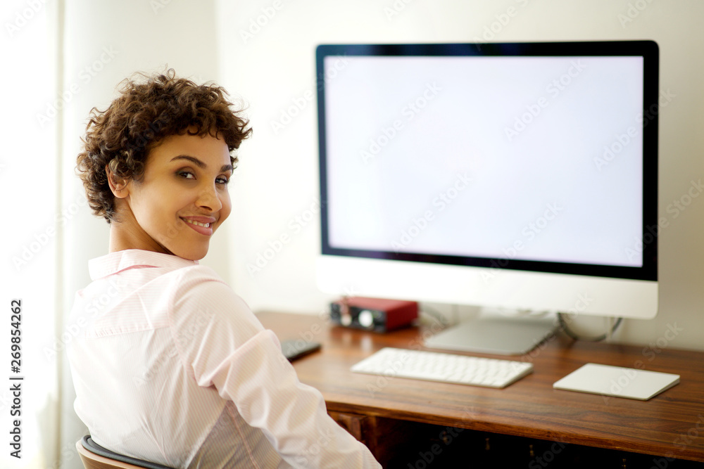 young african american woman sitting by computer screen young african american woman sitting by computer screen