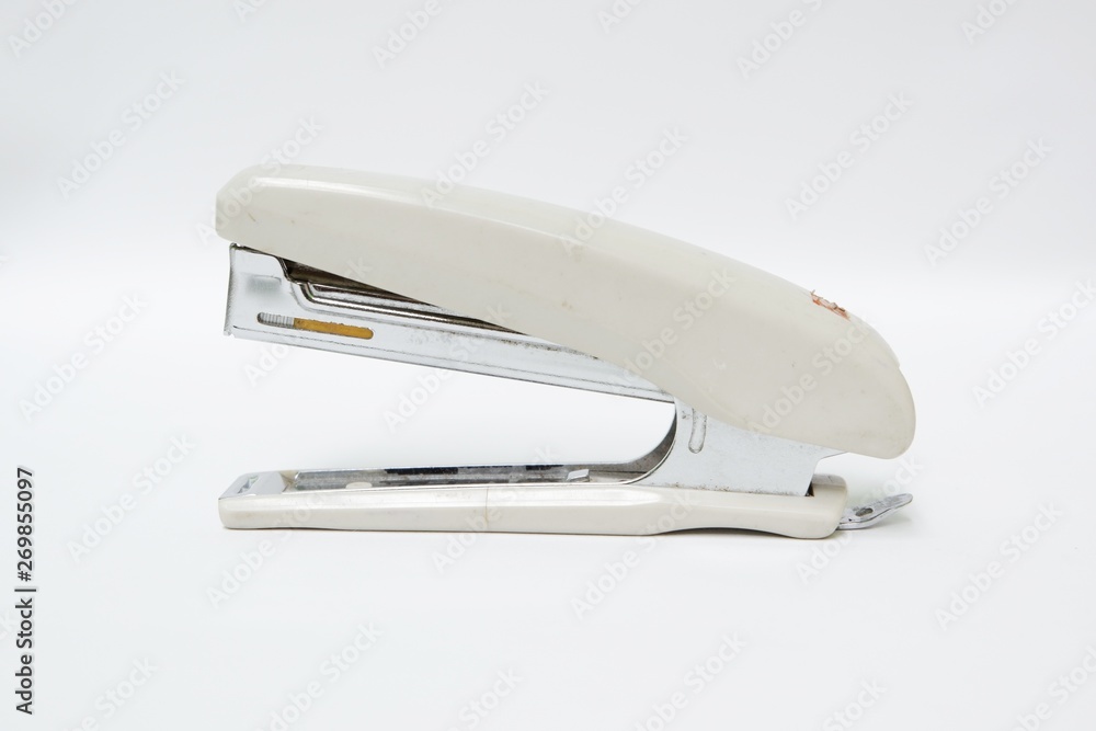 Stapler isolated on white background. Top view close up details. Stapler isolated on white background. Top view close up details.